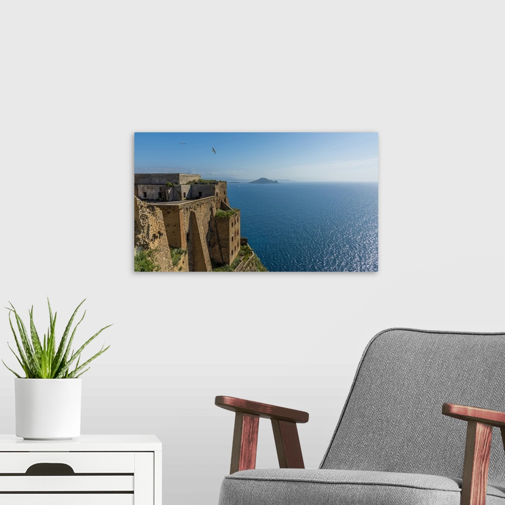 A modern room featuring Europe, Italy, Campania. The palazzo D'Avalos of Procida seen with Capri Island in the background.