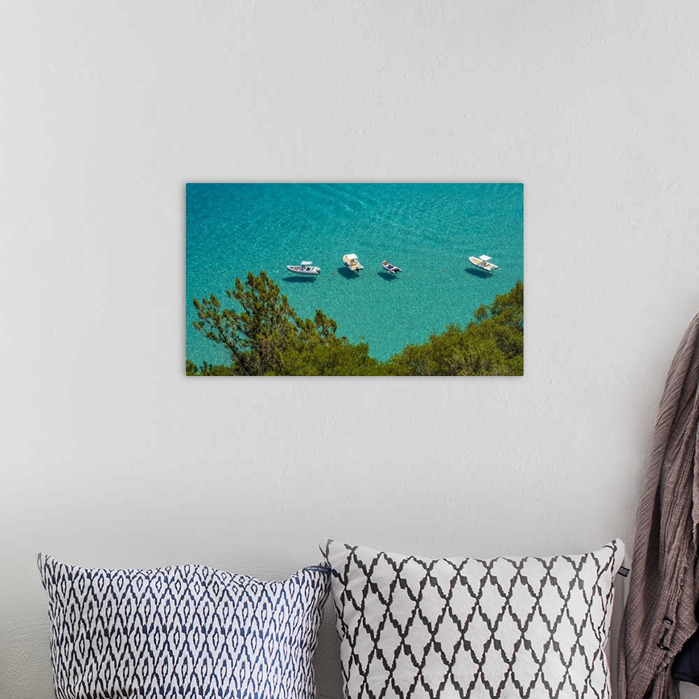 A bohemian room featuring Europe, Italy, Sardinia. View of the boats in Cala Luna.