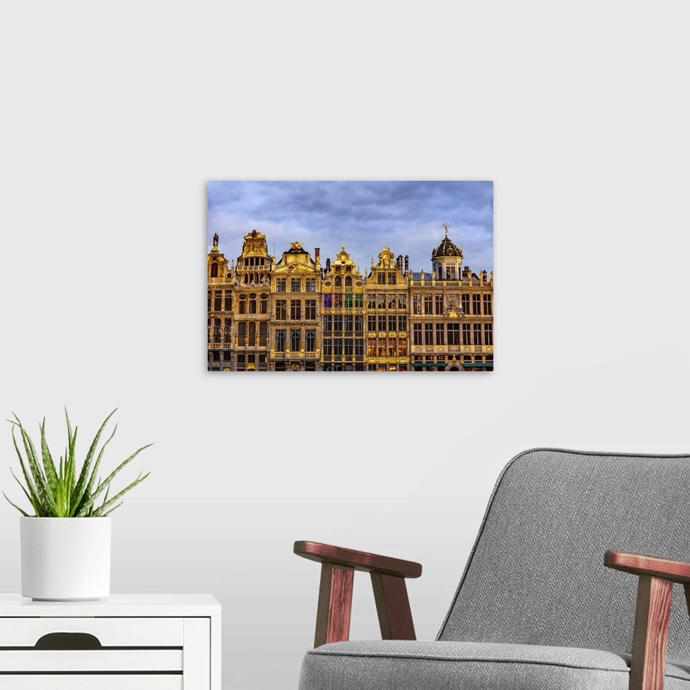 A modern room featuring Facade of the typical houses in Brussels Grand Place by night, Belgium