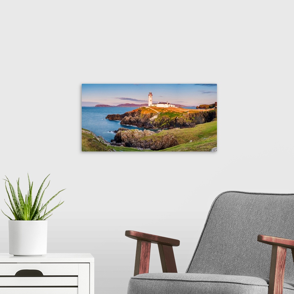 A modern room featuring Fanad Head (Fanaid) lighthouse, County Donegal, Ulster region, Ireland, Europe. Panoramic view of...