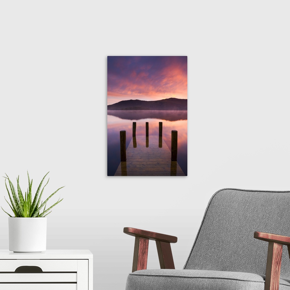 A modern room featuring Fiery sunrise over Derwent Water from Hawes End jetty, Lake District National Park, Cumbria, Engl...