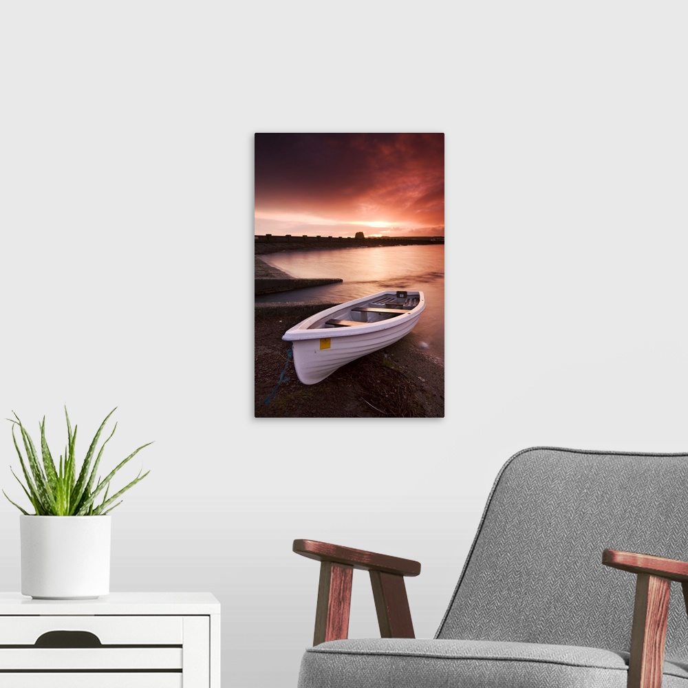 A modern room featuring Fishing boat tethered on the shores of the Usk Reservoir at sunrise, Brecon Beacons National Park...