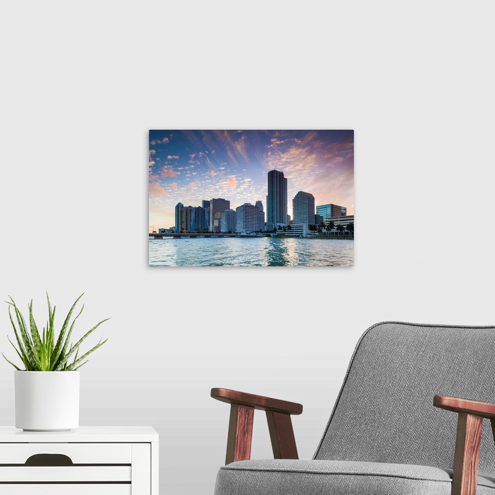 A modern room featuring USA, Florida, Miami, city skyline from Brickell Key, dusk