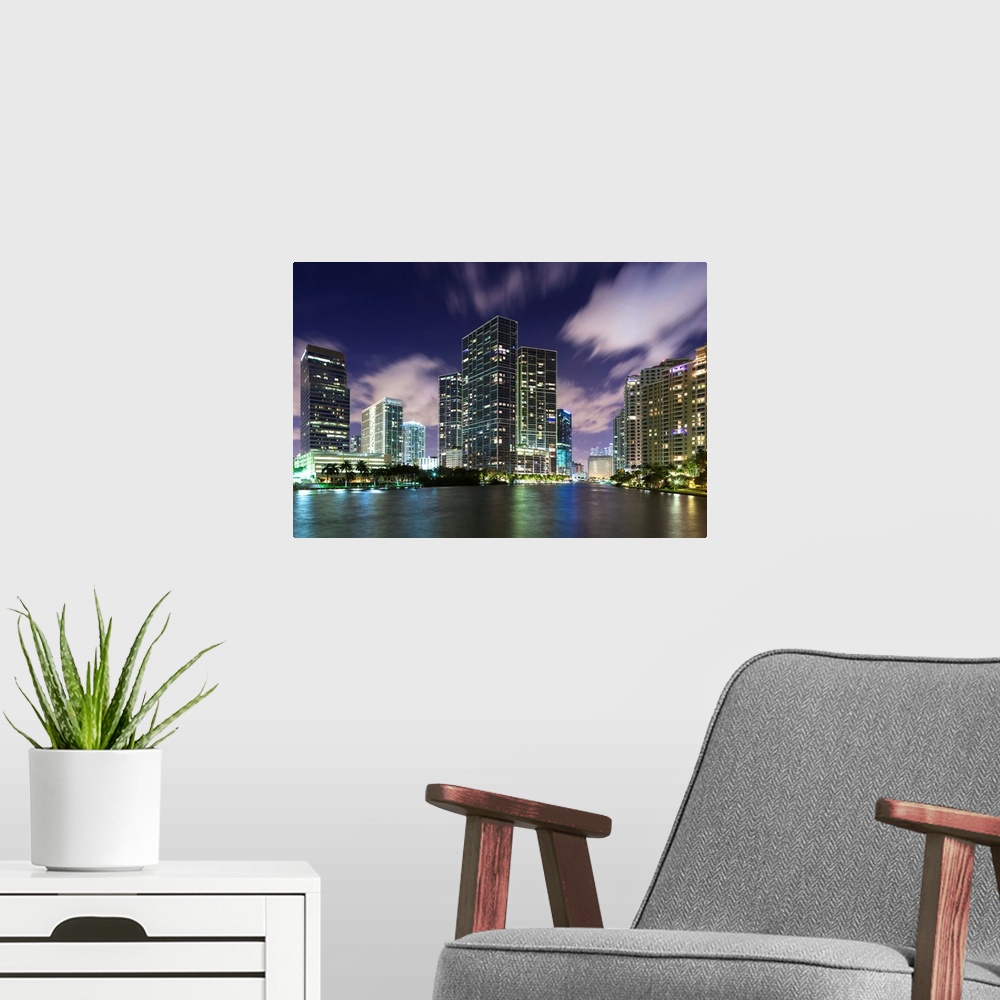 A modern room featuring USA, Florida, Miami, city skyline from Brickell Key, evening