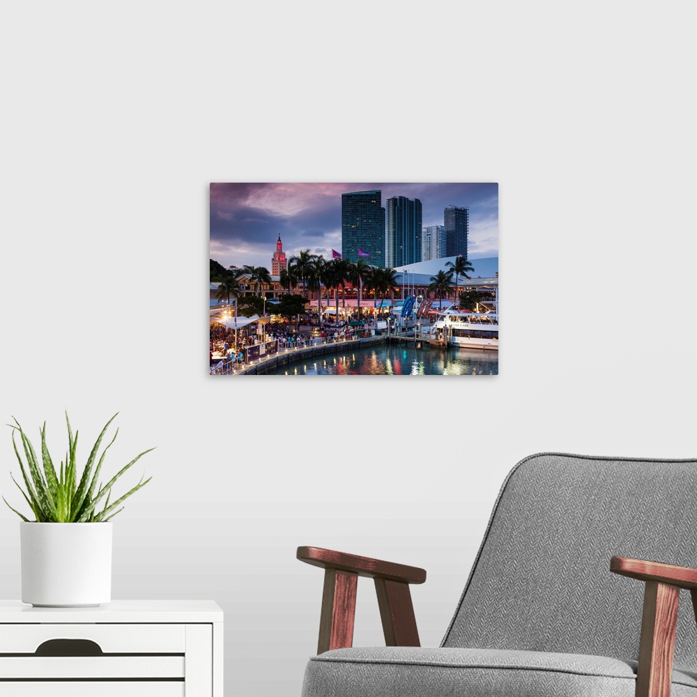 A modern room featuring USA, Florida, Miami, city skyline with Bayside Mall and Fredom Tower, evening