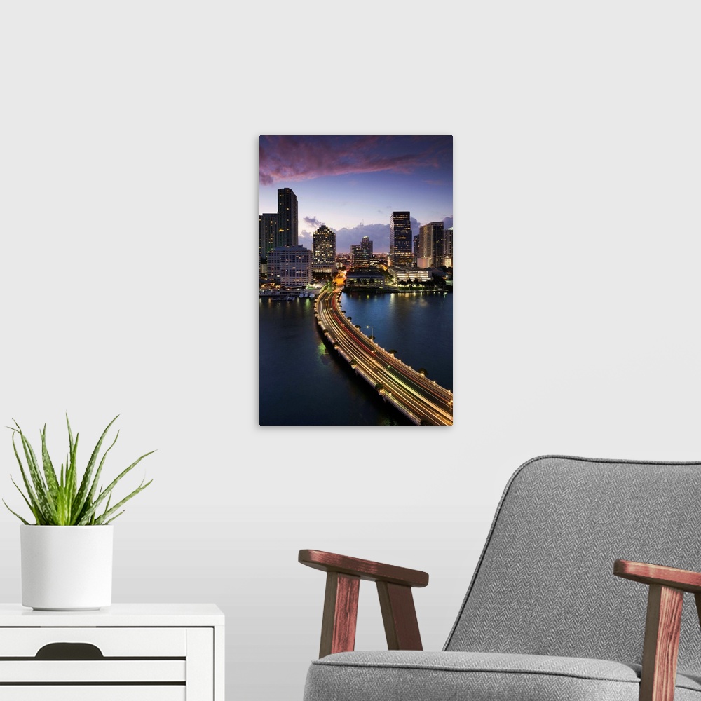A modern room featuring USA, Florida, Miami, elevated city skyline from Brickell Key, evening