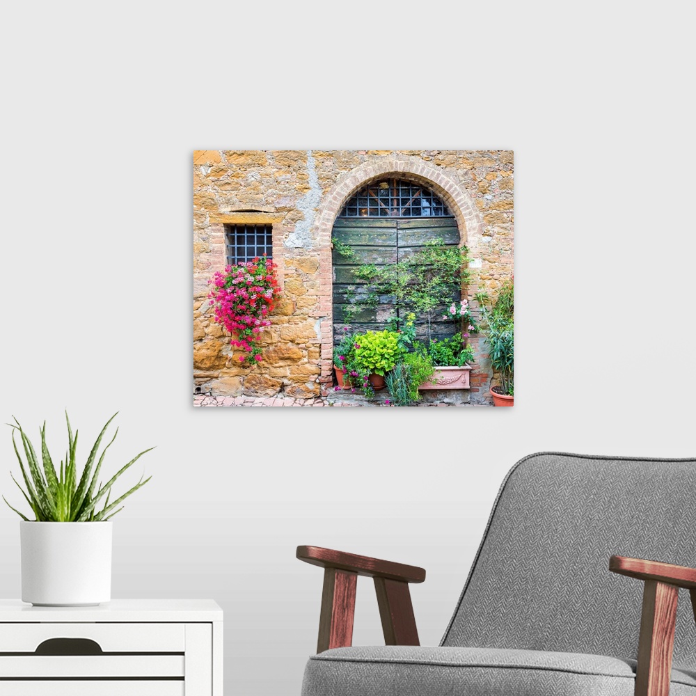 A modern room featuring Flowers And Green Door, Monitisi, Tuscany, Italy