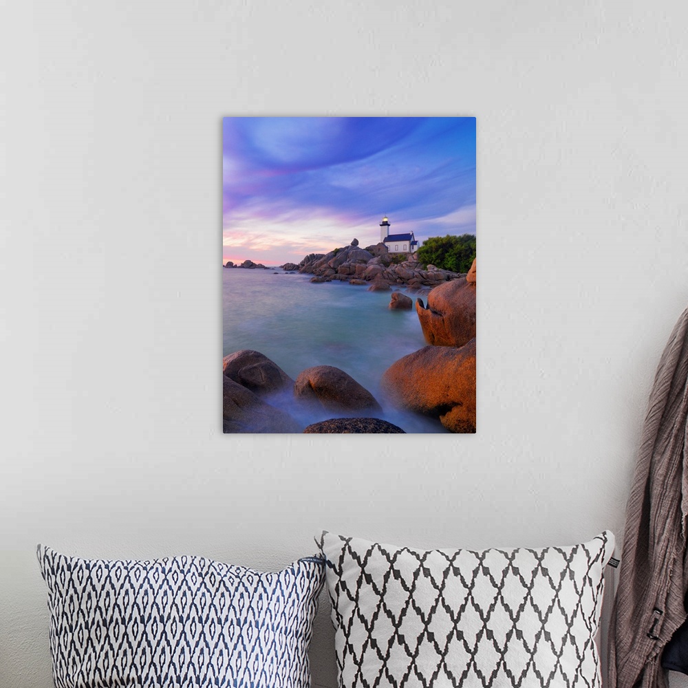 A bohemian room featuring France, Brittany, Finistere, Brignogan Plages, Pontusval Lighthouse on Pointe de Beg Pol at dusk.
