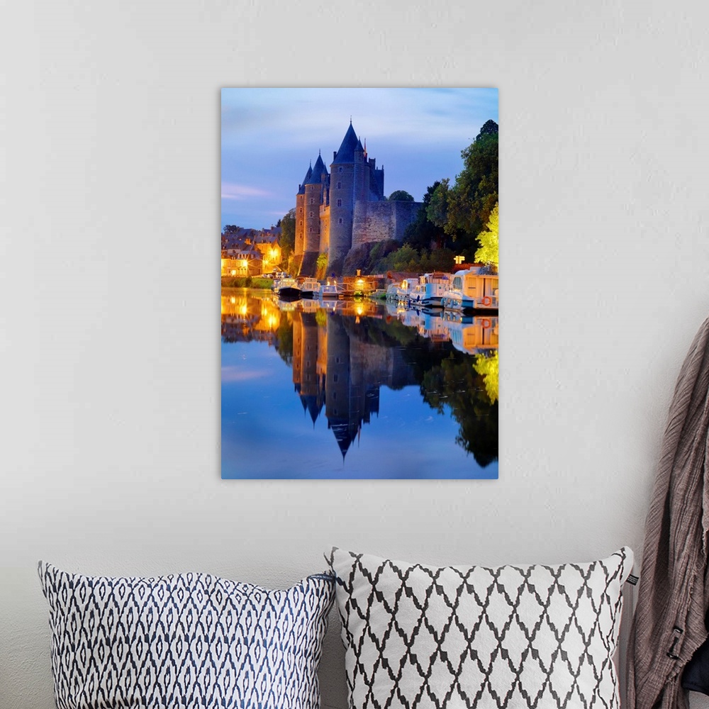 A bohemian room featuring France, Brittany, Morbihan, Josselin, Chateau de Rohan castle on the Oust River at night.