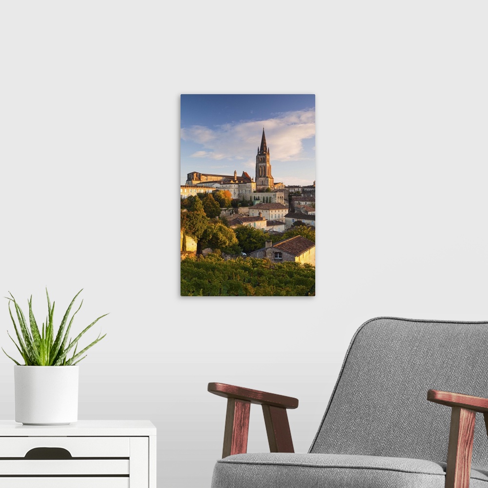 A modern room featuring France, Aquitaine Region, Gironde Department, St-Emilion, wine town, town view with Eglise Monoli...