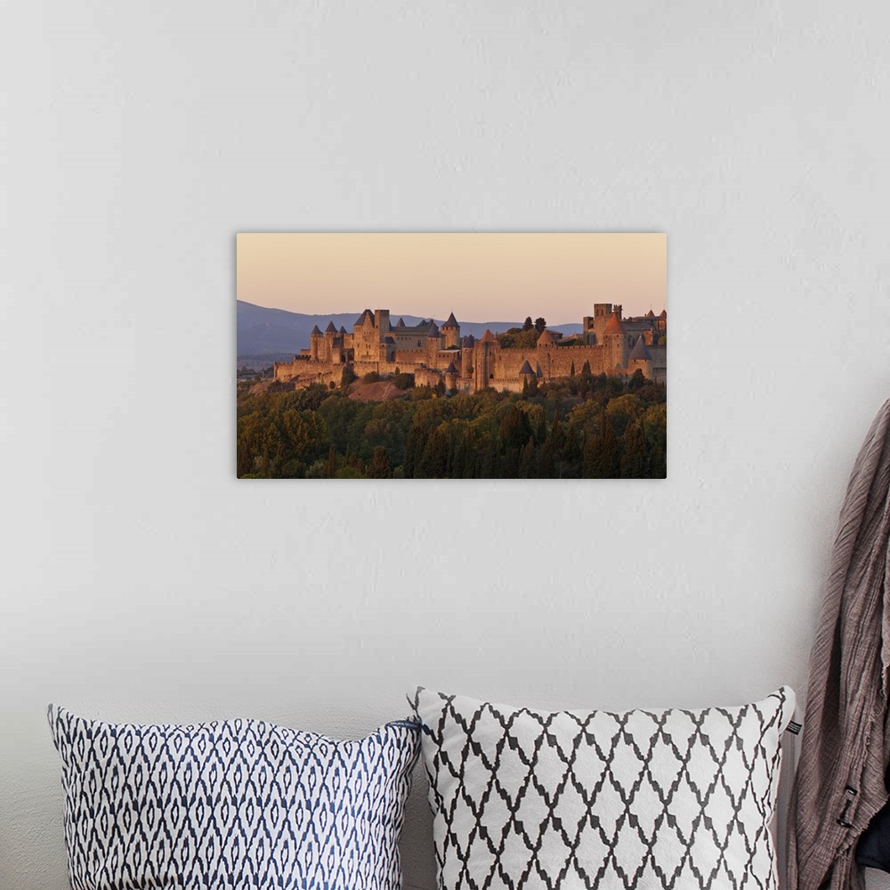 A bohemian room featuring France, Languedoc-Rousillon, Carcassonne. The fortifications of Carcassonne at dusk.