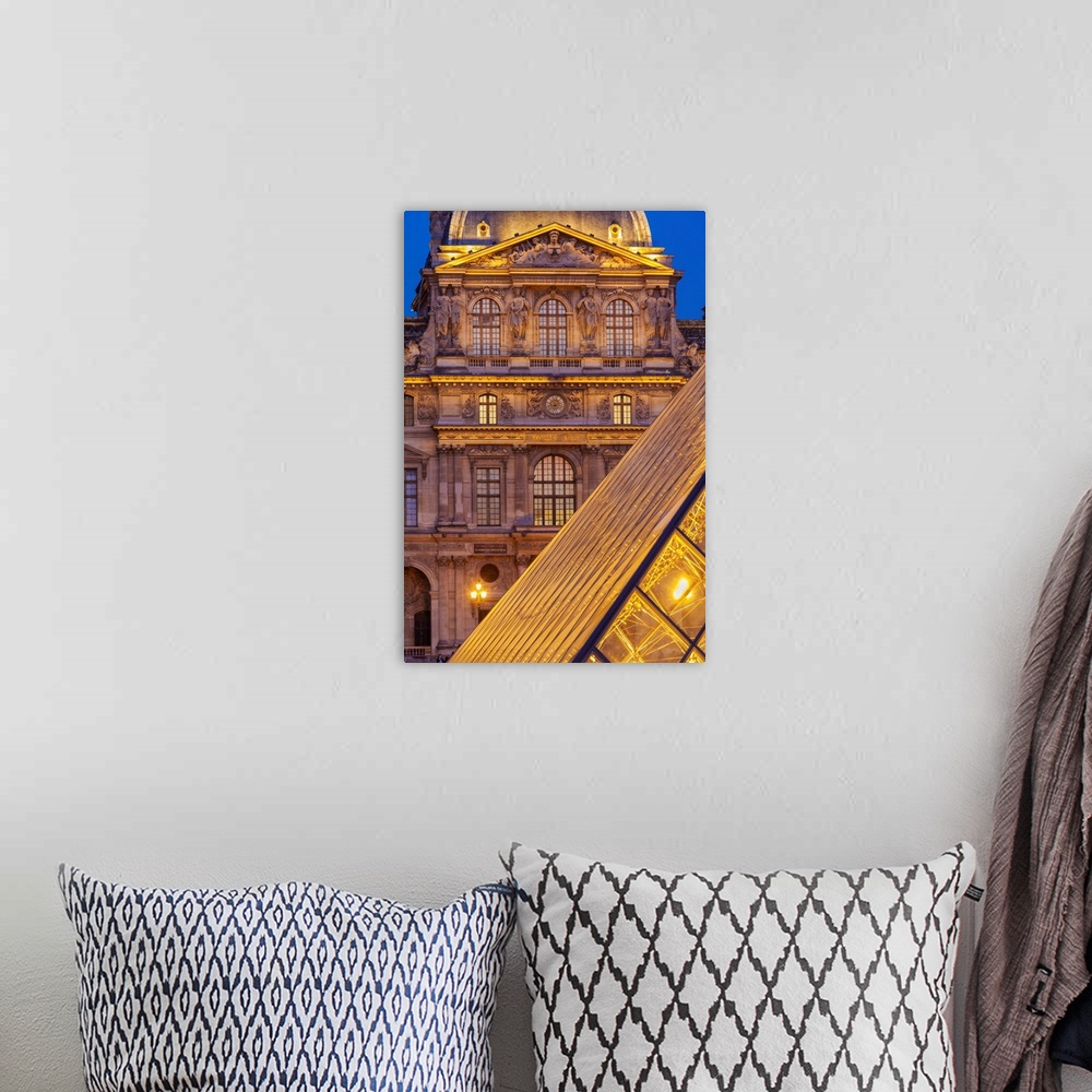 A bohemian room featuring France, Paris, The Louvre, Pyramid at dusk.