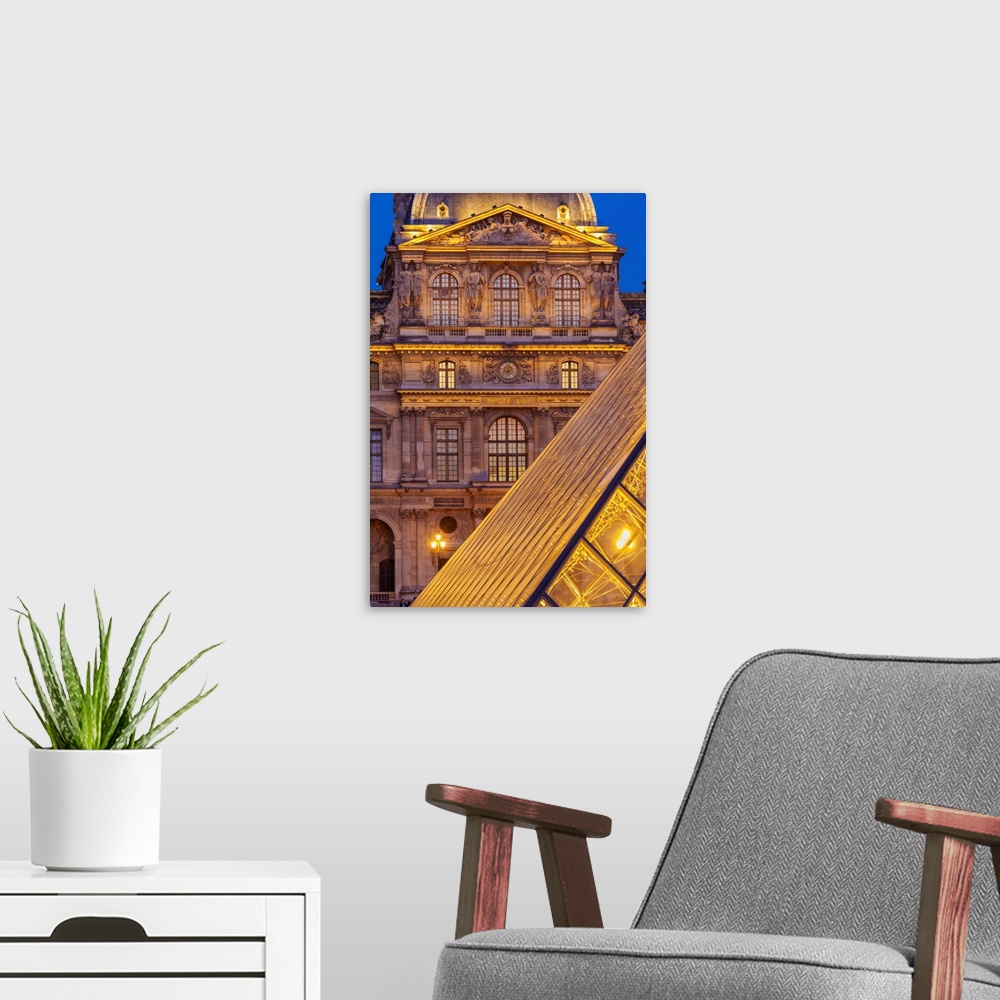 A modern room featuring France, Paris, The Louvre, Pyramid at dusk.