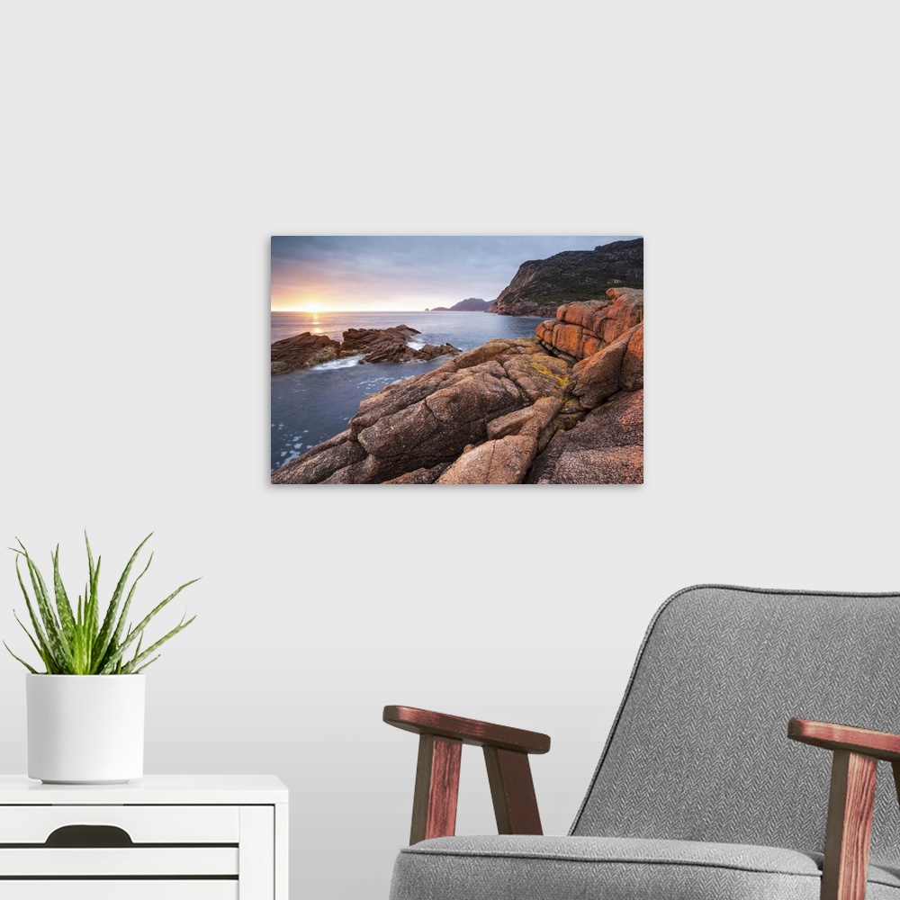 A modern room featuring Freycinet National Park, Tasmania, Australia. Sunrise over the coastline