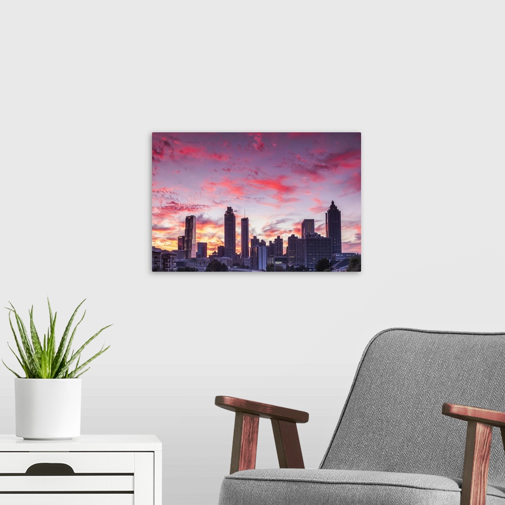 A modern room featuring USA, Georgia, Atlanta, city skyline from Interstate 20, dusk