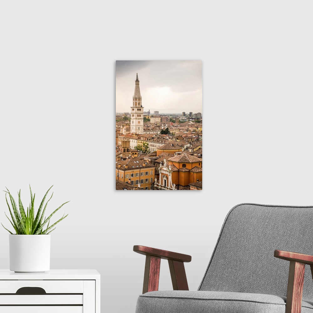 A modern room featuring Ghirlandina tower from top of Military Academy Palace in Piazza Roma. Modena, Emilia Romagna, Italy