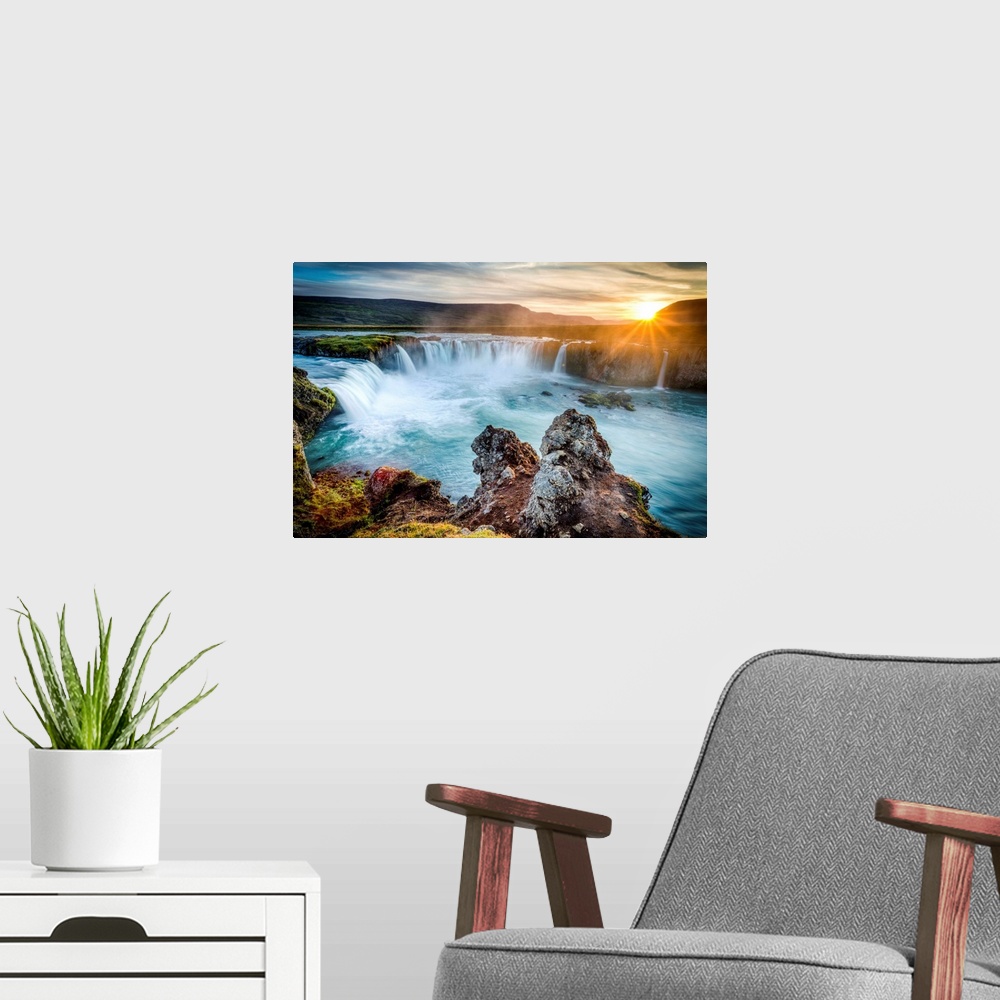 A modern room featuring Godafoss, Myvatn, Iceland. the waterfall of the Gods at sunset.