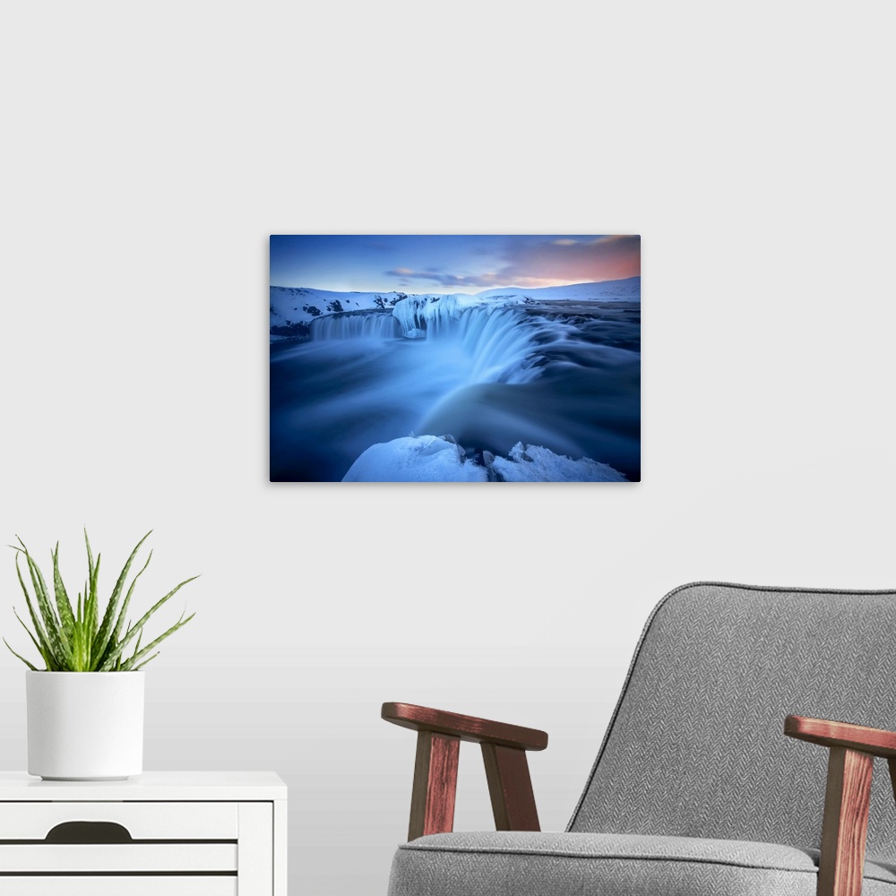 A modern room featuring Godafoss waterfall during a cold sunset in winter, Nordurland, Iceland