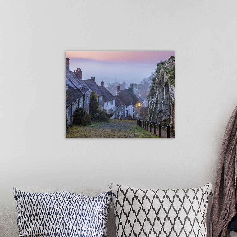 A bohemian room featuring Gold Hill at dawn, Shaftesbury, Dorset, England, UK.