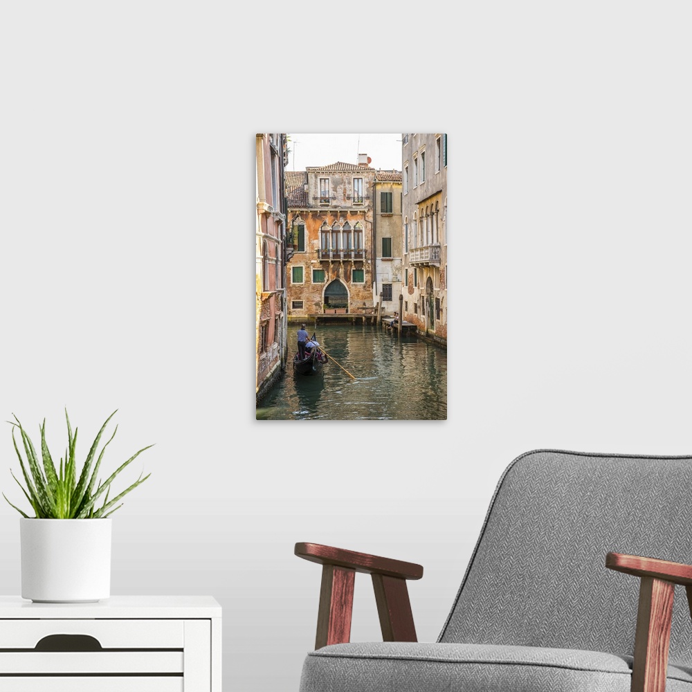 A modern room featuring Gondola on canal in Venice, Veneto, Italy.