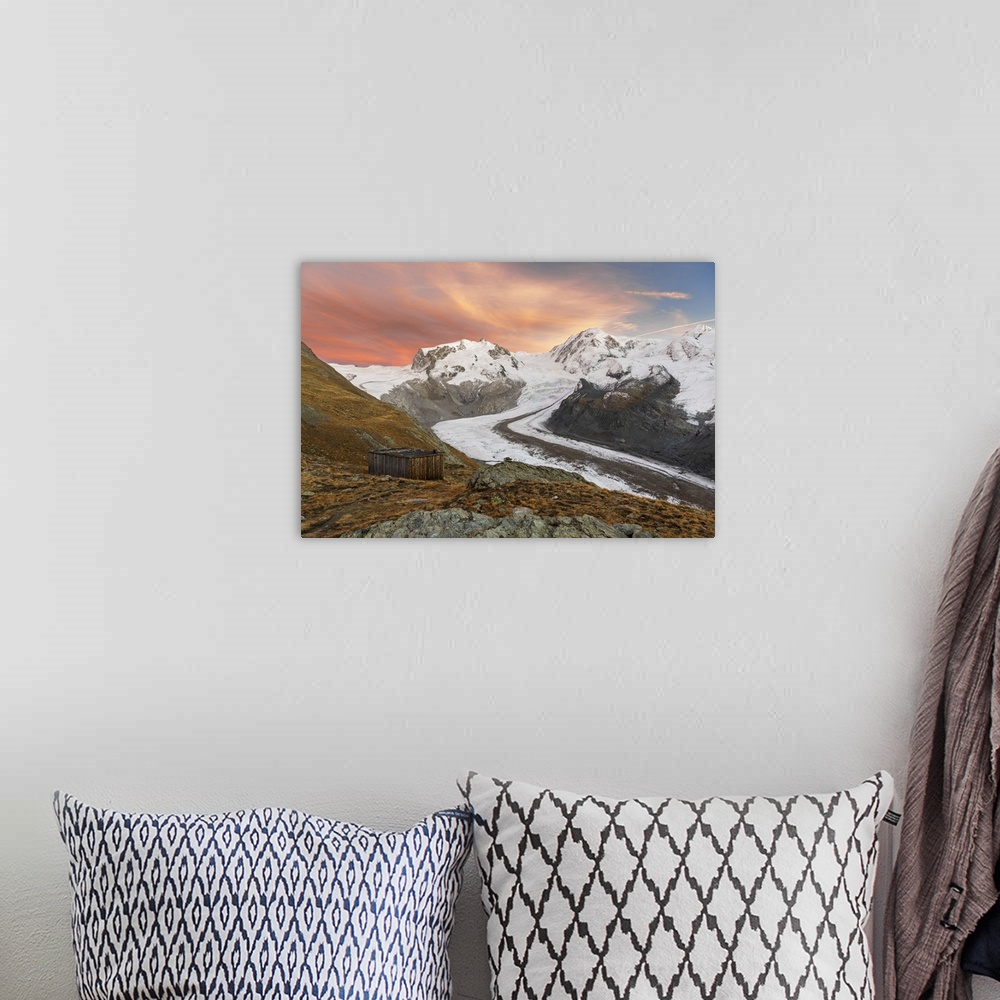A bohemian room featuring Gorner glacier with the Monte Rosa massif and Lyskamm peaks at dusk, Zermatt, Valais canton, Swit...