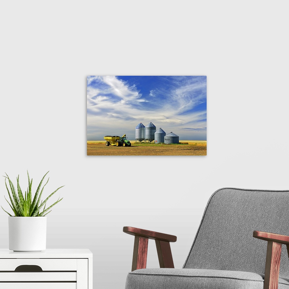 A modern room featuring Grain Bins And Cart In Lentil Field, Lang, Saskatchewan, Canada