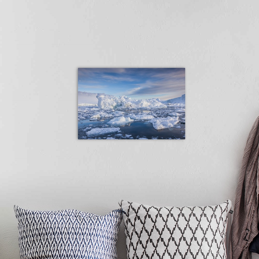 A bohemian room featuring Greenland, Disko Bay, Ilulissat, floating ice at sunset.