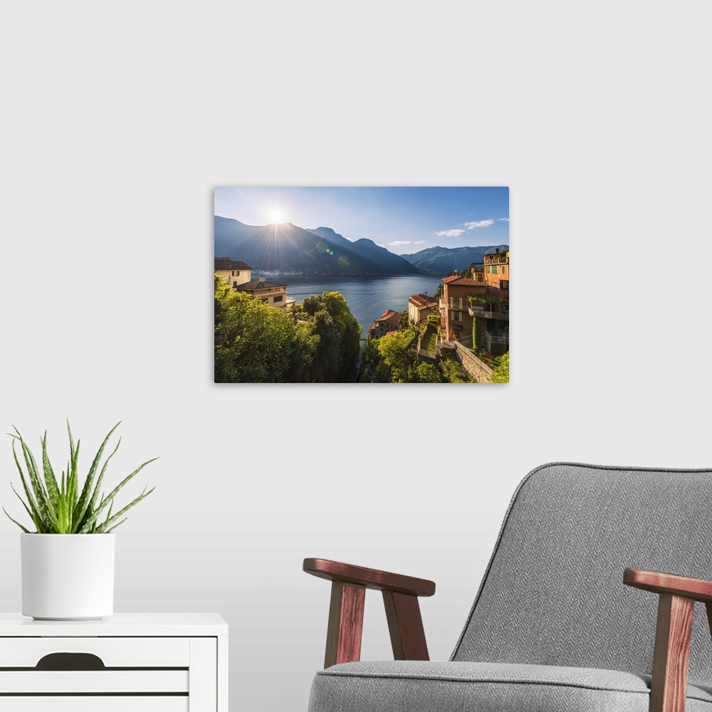 A modern room featuring Nesso, lake Como, Como province, Italy, Europe. High angle view over the roman stone bridge and t...