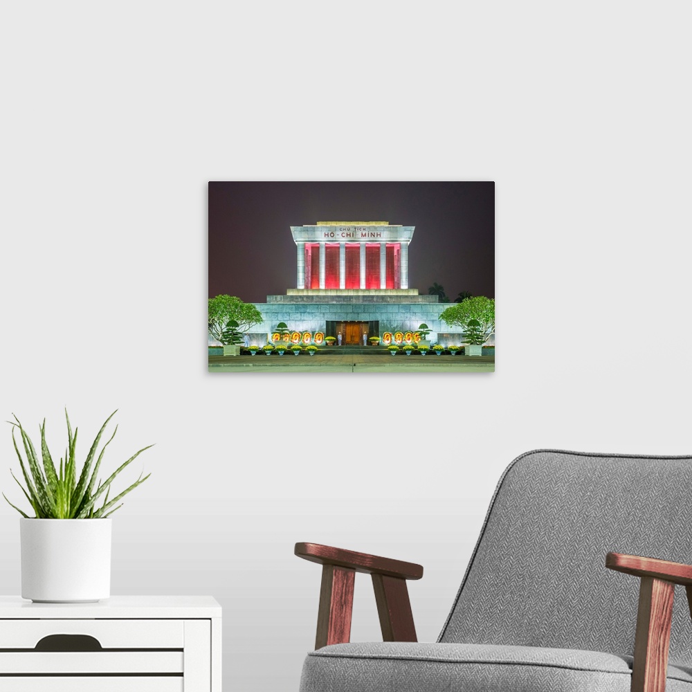 A modern room featuring Ho Chi Minh Mausoleum on Ba Dinh Square at night, Hanoi, Vietnam.