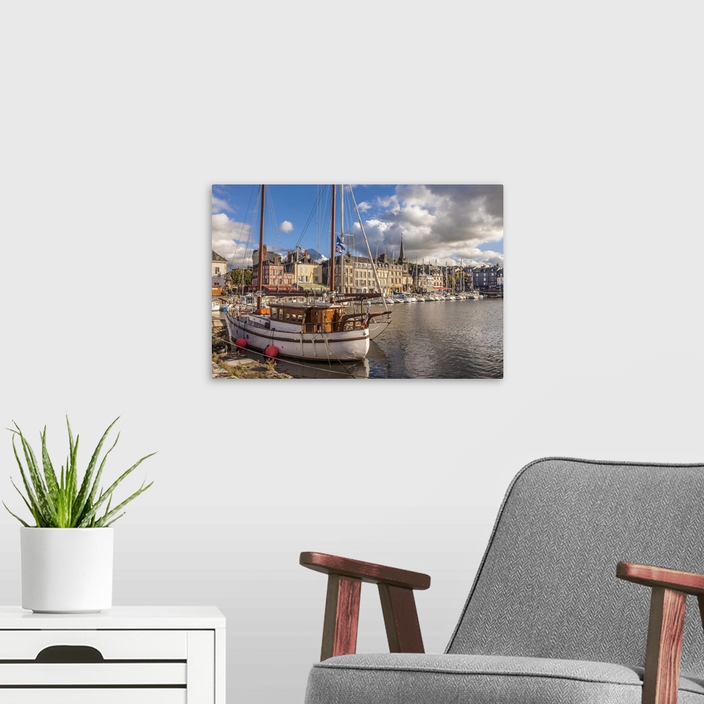 A modern room featuring Honfleur harbor in the evening light, Calvados, Normandy, France.