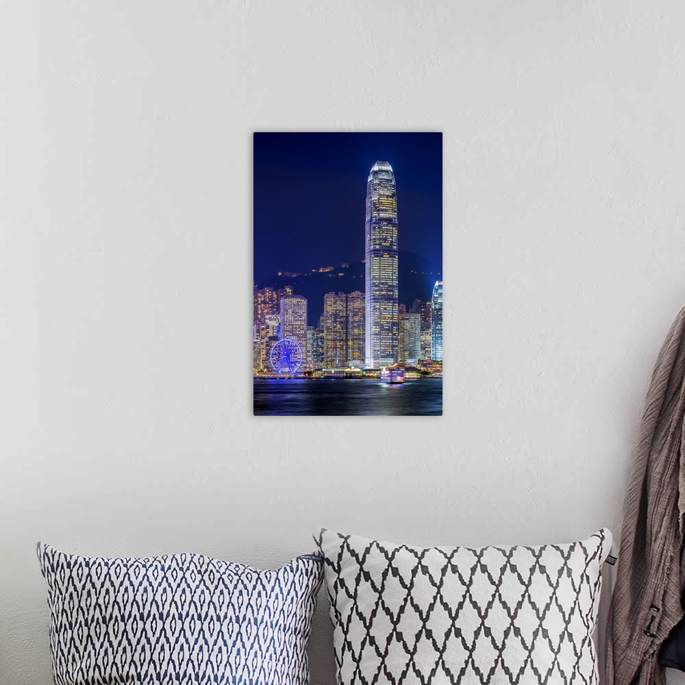 A bohemian room featuring Hong Kong skyline, IFC Tower and skyscrapers on Hong Kong Island at night seen from Tsim Sha Tsui...