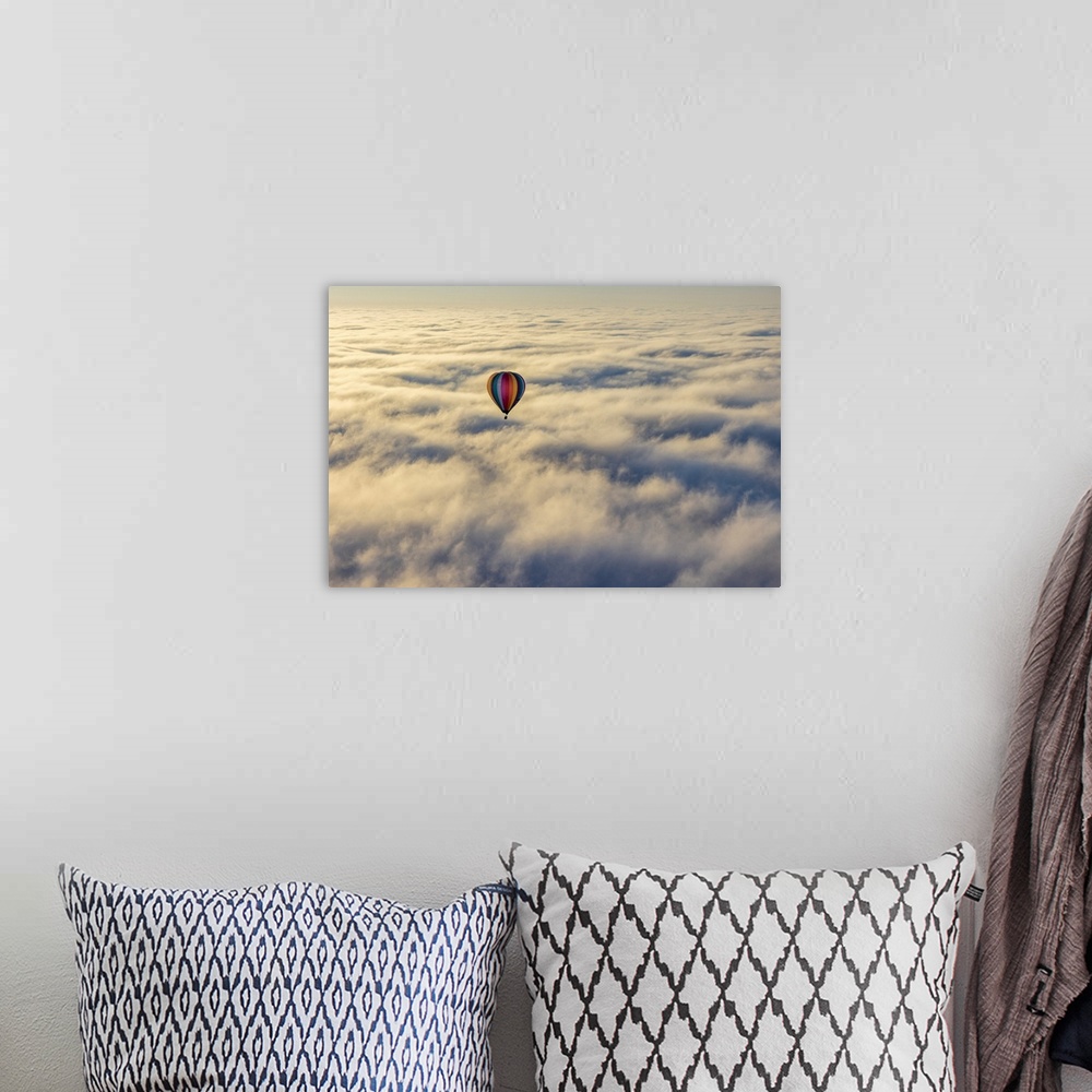 A bohemian room featuring Hot air balloon above low cloud, Yarra Valley, Victoria, Australia.