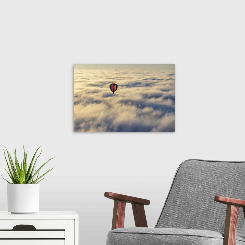 A modern room featuring Hot air balloon above low cloud, Yarra Valley, Victoria, Australia.