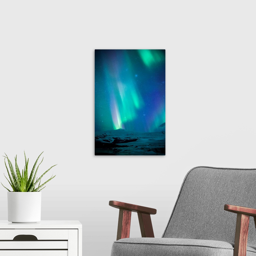 A modern room featuring Iceland, Fjallsarlon. The Northern Lights appearing in the sky at Fjallsarlon.