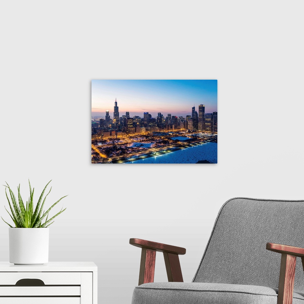 A modern room featuring USA, Illinois, Chicago. Aerial dusk view of the city and Millennium Park in winter.