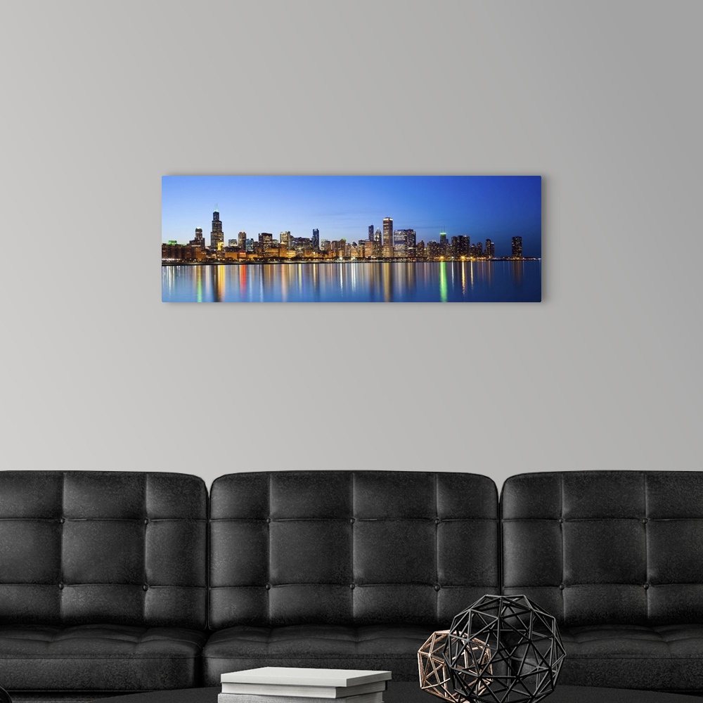A modern room featuring USA, Illinois, Chicago. Dusk view of the skyline from Lake Michigan.