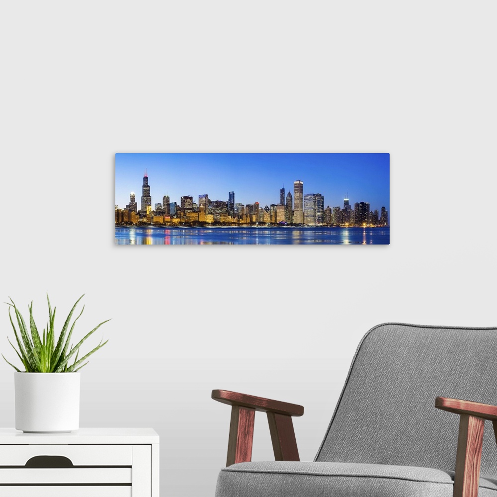 A modern room featuring USA, Illinois, Chicago. The City Skyline and a frozen Lake Michigan.