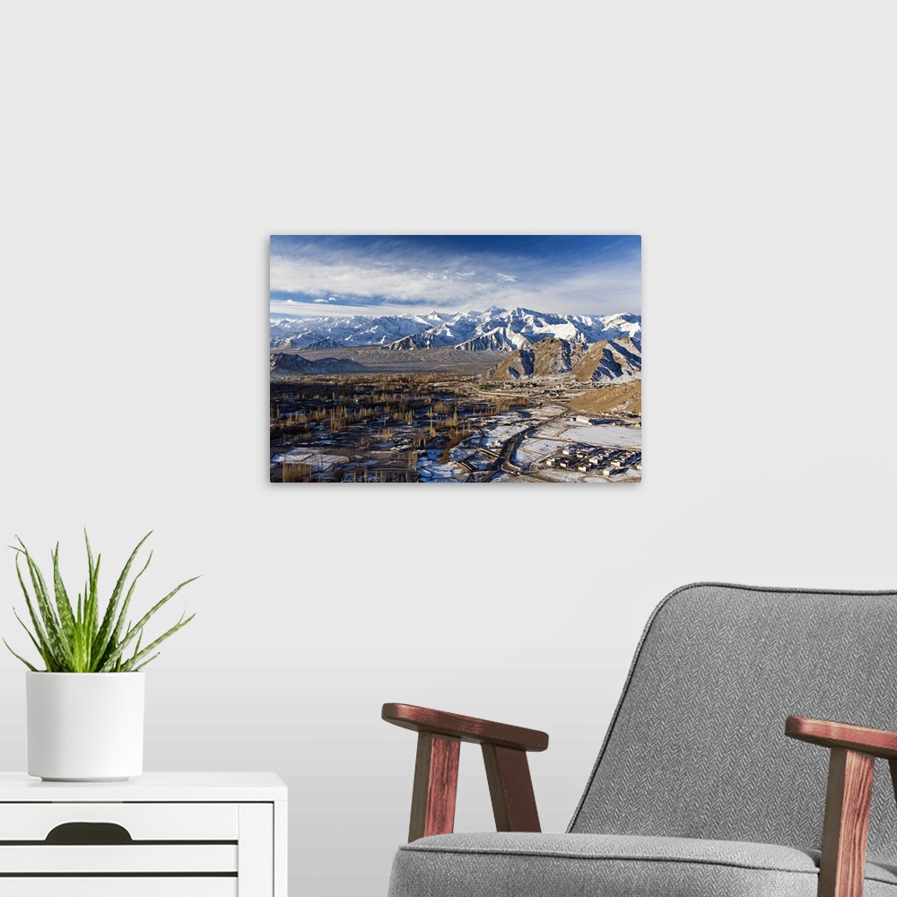 A modern room featuring India, Ladakh, Leh. Looking south out over Leh, capital of Ladakh, towards the Zanskar Range, wit...