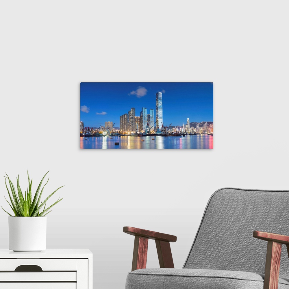 A modern room featuring International Commerce Centre (ICC) and Yau Ma Tei Typhoon Shelter at dusk, West Kowloon, Hong Ko...