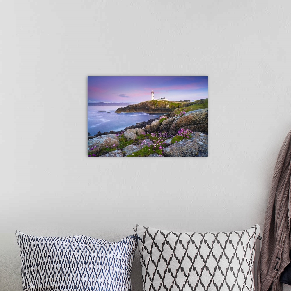 A bohemian room featuring Ireland, Co. Donegal, Fanad, Fanad lighthouse with Sea thrift in foreground at dusk.