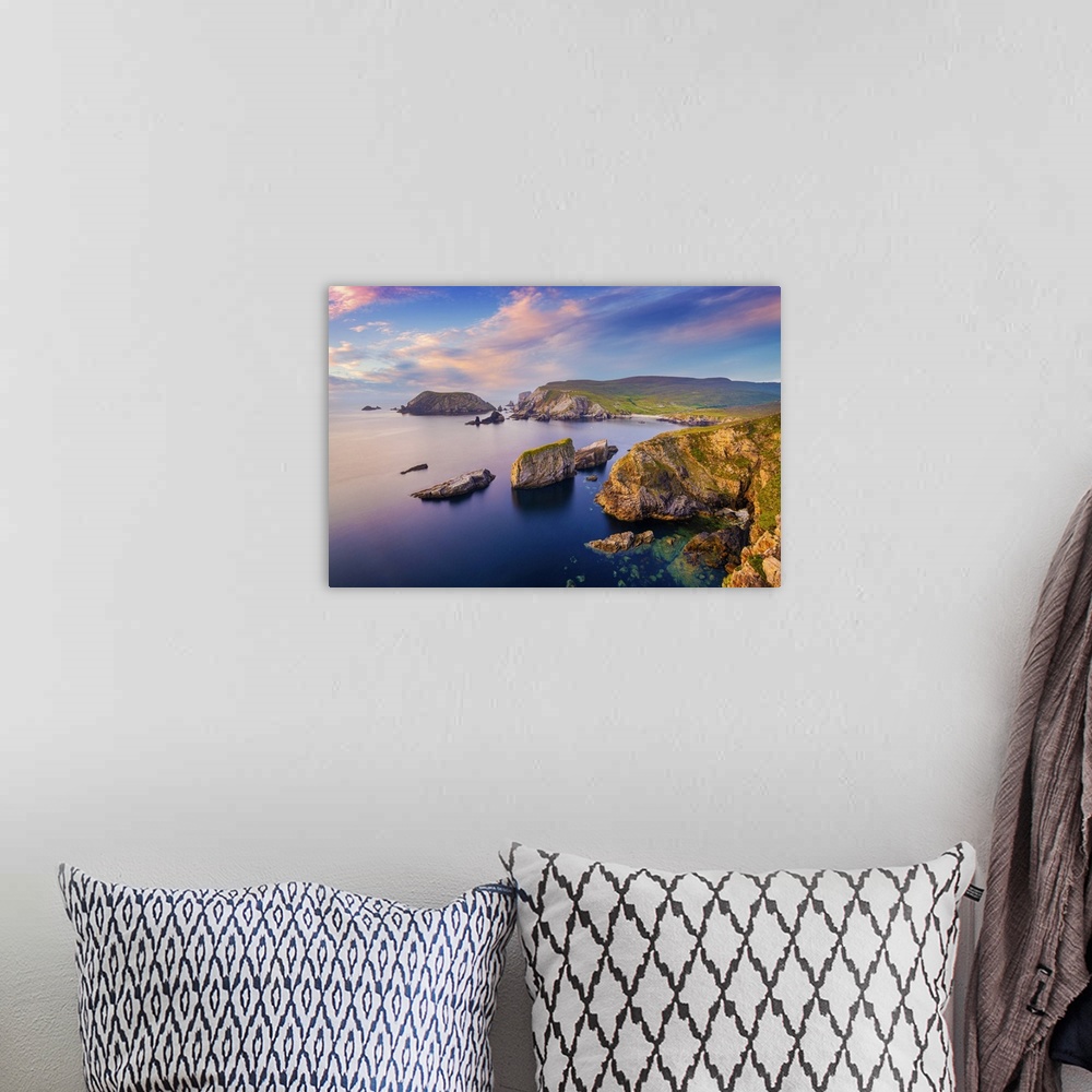 A bohemian room featuring Ireland, Co.Donegal, Port (An Port), Rocky coastline at dusk.