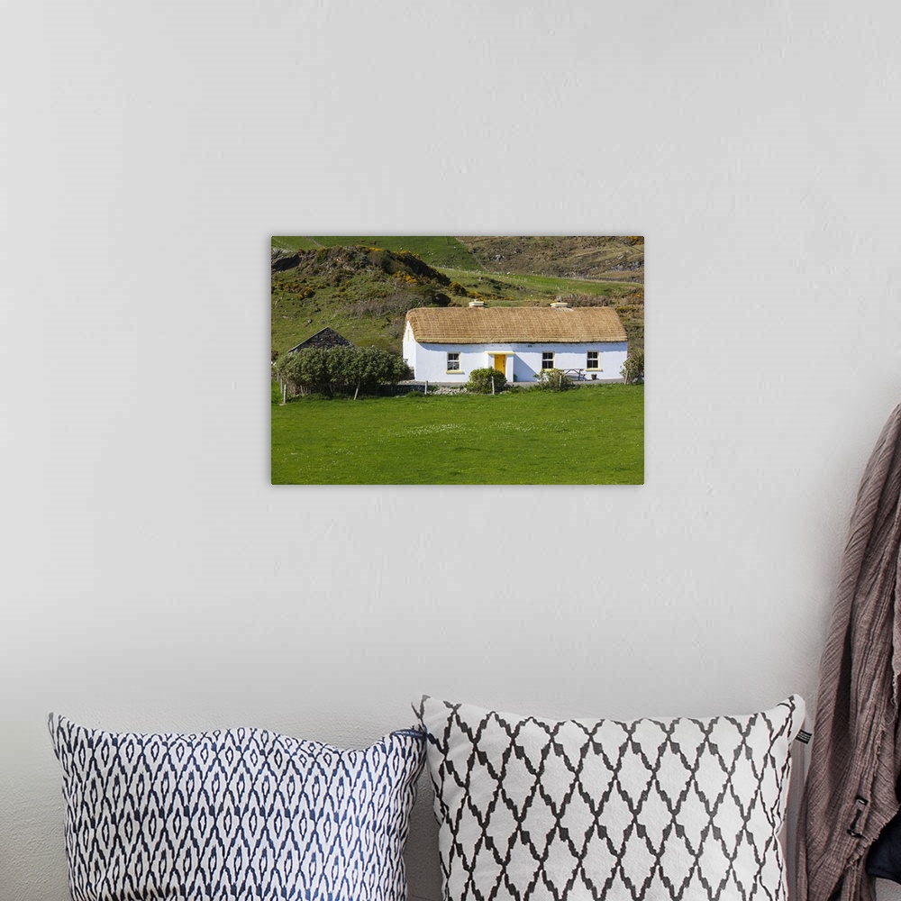 A bohemian room featuring Ireland, County Donegal, Glengesh Pass, landscape with traditional house.