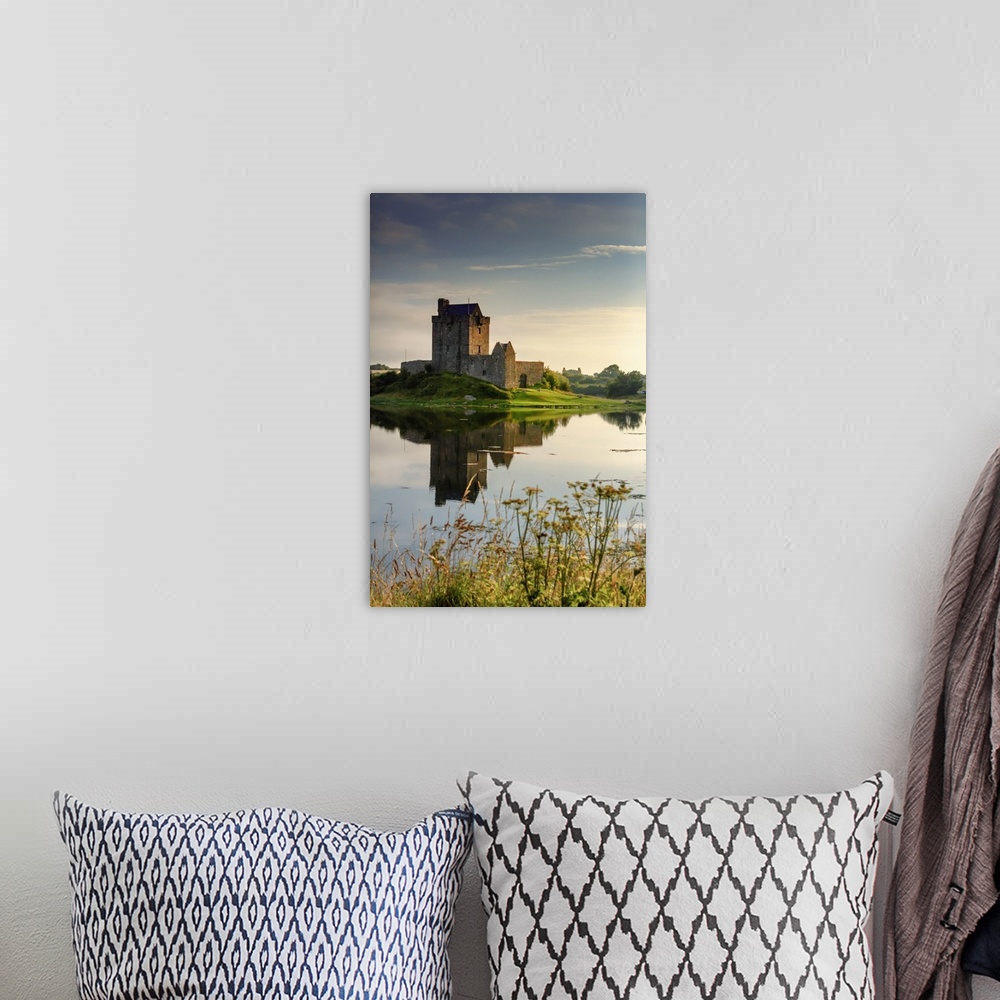 A bohemian room featuring Europe, Ireland, Dunguaire castle at sunrise in Kinvara village reflecting in the Atlantic Ocean