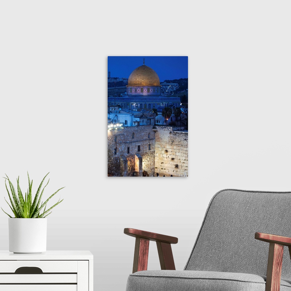 A modern room featuring Israel, Jerusalem, Old City, Jewish Quarter, elevated view of the Western Wall Plaza, late evening