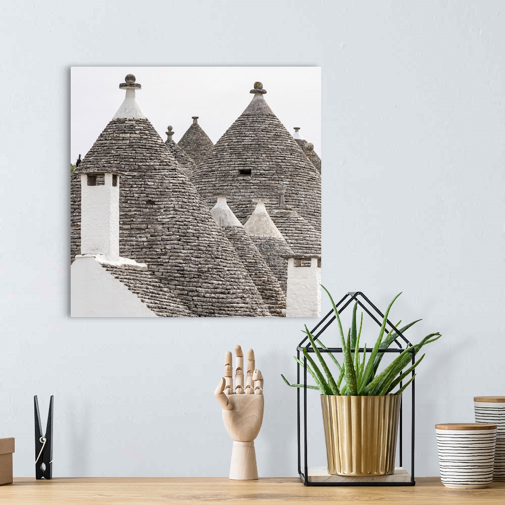 A bohemian room featuring Europe, Italy, Apulia. Alberobello, some of the typical Trulli houses.