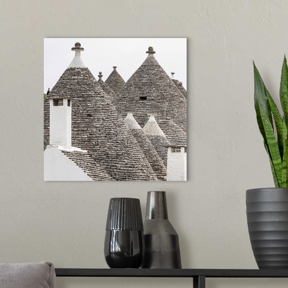A modern room featuring Europe, Italy, Apulia. Alberobello, some of the typical Trulli houses.