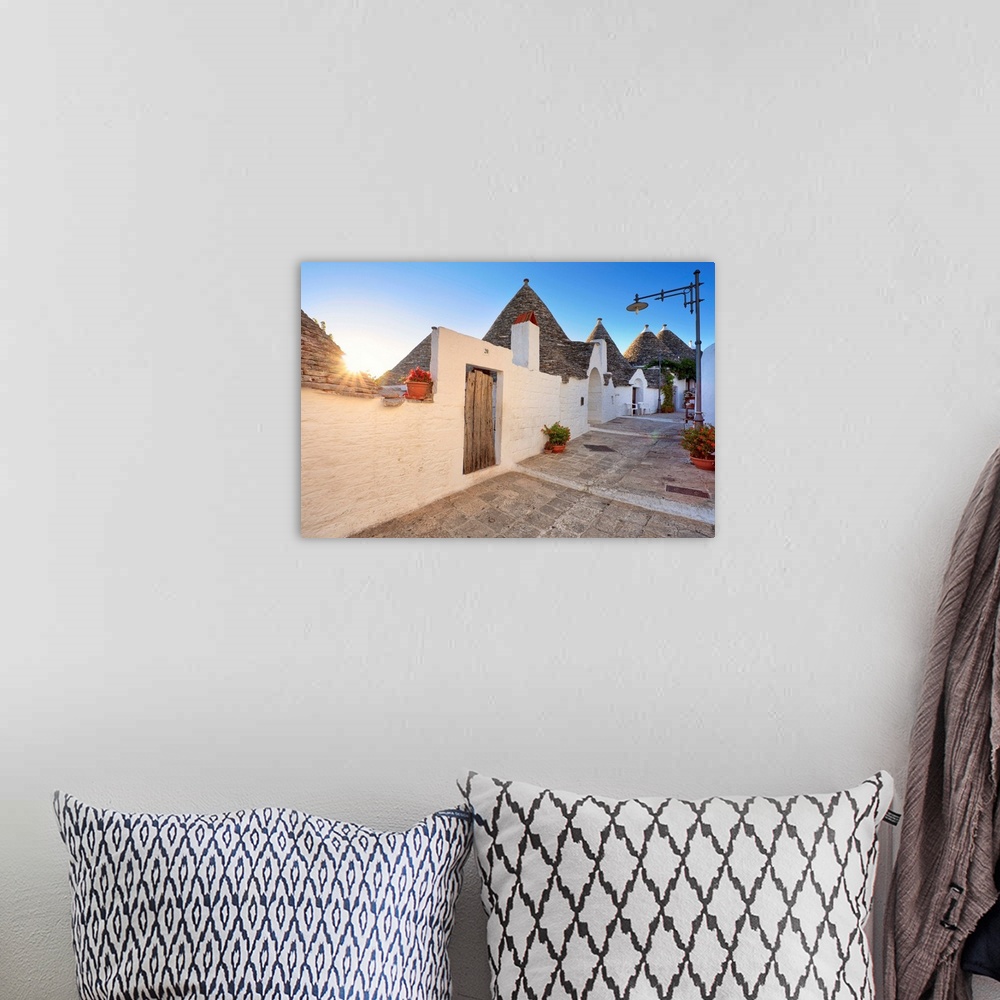 A bohemian room featuring Italy, Apulia, Bari district, Itria Valley. Alberobello. Trulli (typical houses)