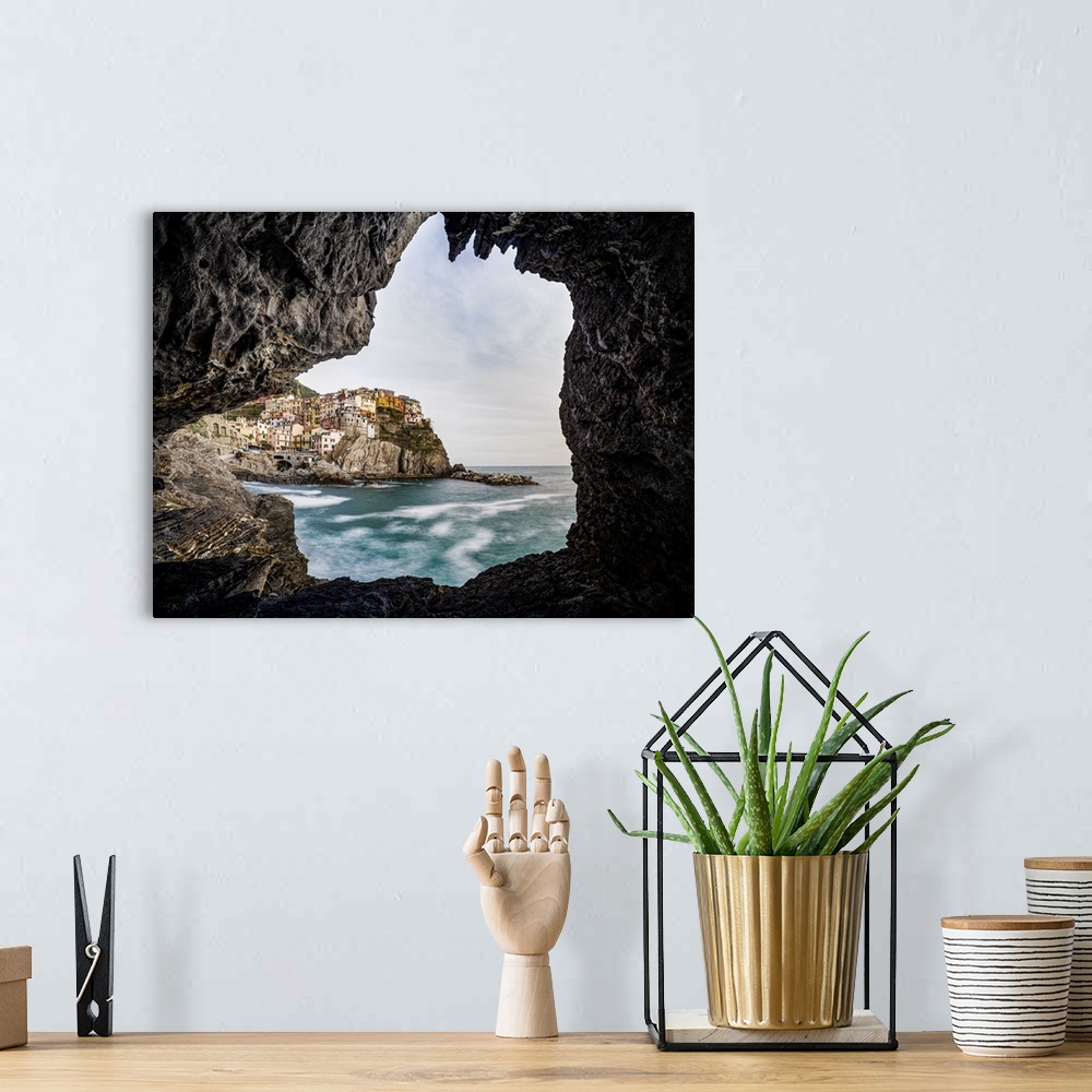 A bohemian room featuring Italy, Liguria: Manarola from a cave on the shore.