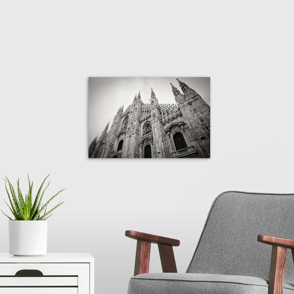 A modern room featuring Italy, Lombardy, Milan, Piazza Duomo, Duomo cathedral, defocussed