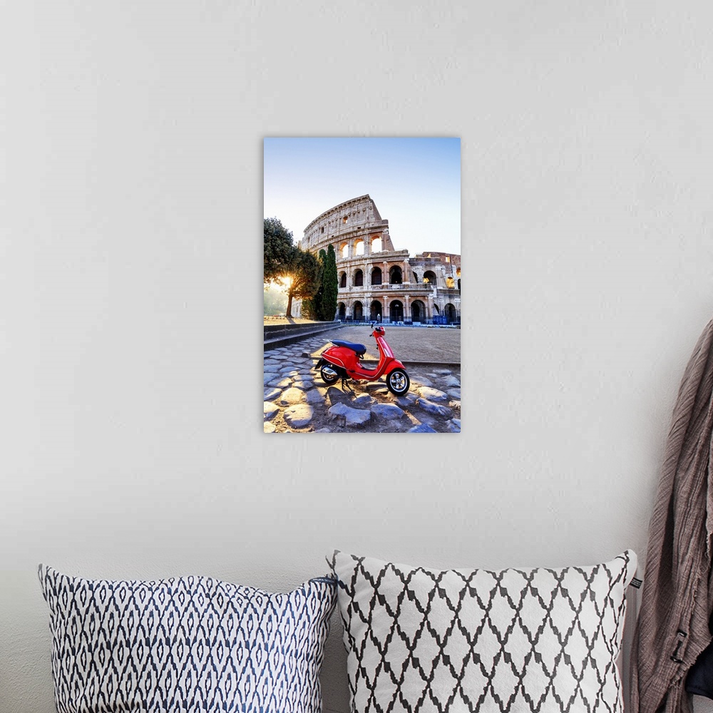 A bohemian room featuring Italy, Rome, a red Vespa motorbike in front of Colosseum at sunrise